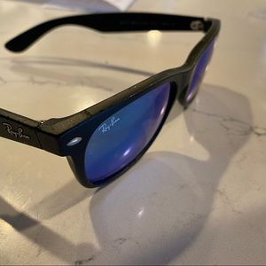 Wayfarer Ray-bans. Blue lens.